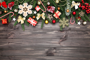 Christmas tree branches with toys on wooden table