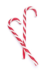Tasty red candy cane  on white background. Festive treat