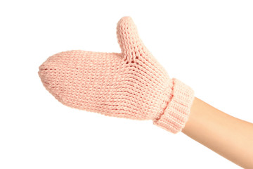 Hand in knitted mitten on white background