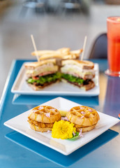 Chicken and waffle slider sandwich. An inventive take on a southern classic served in an upscale restaurant for brunch or breakfast. 