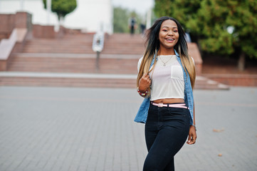 Young black female posed in the city. African women single portrait.