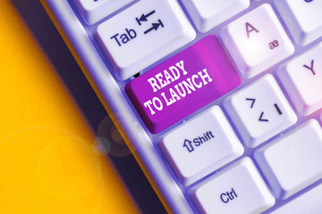 Conceptual hand writing showing Ready To Launch. Concept meaning an event to celebrate or introduce something new to market White pc keyboard with note paper above the white background