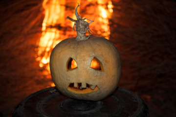 Scary pumpkin for Halloween on fire
