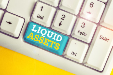 Writing note showing Liquid Assets. Business concept for Cash and Bank Balances Market Liquidity...