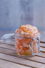 Sauerkraut  with carrots in a glass jar. Is a fermented vegetables. Typical fermented food.