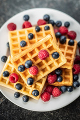 Waffles with blueberries and raspberries.