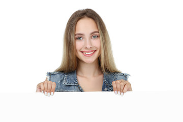 Beautiful young woman holding blank board on white background