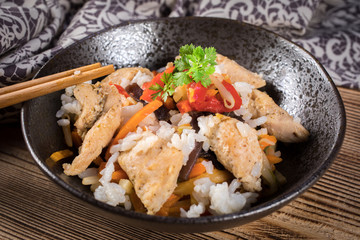 Fried chicken with rice and vegetables.