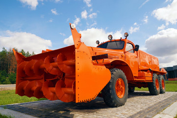 Antique snow plow. Vehicle display at the highway.