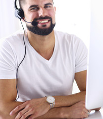 Businessman in the office on the phone with headset, Skype