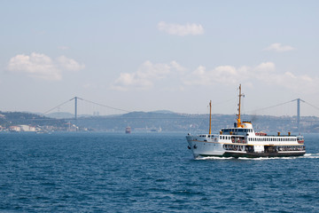 Fototapeta premium View of Istanbul's ferry and Bosphorus bridge in the background.
