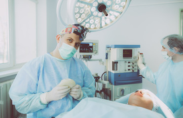 Man surgeon at work in operating room