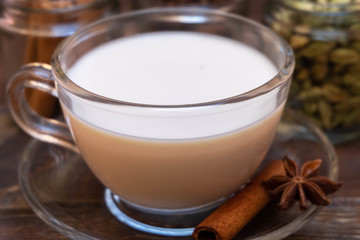 Closeup image of traditional indian masala chai tea with spices