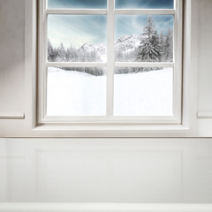 Snowy winter outside the window background with space on wooden board top for products and decorations. Christmas decorations.