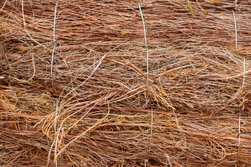 Rough fabric made from natural raw plant fiber. Horizontal. Wallpaper and background about eco friendly material, textile industry, insulating layer for building houses.
