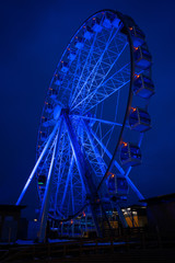 Photo of ferris wheel against background of night sky