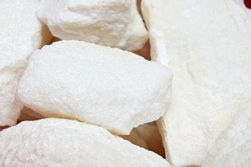 Fototapeta na wymiar White sugar lumpy in detail.