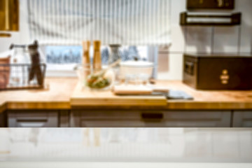 Wooden table background on a blurred kitchen goods and accessories view. Empty space for decoration and advertising products.