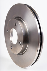 Steel brake discs for a passenger car. New spare parts for car repairs.