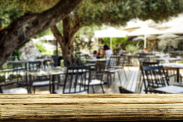 Table background  in a restaurant outdoor view. Empty  space for your decoration and an advertising product.