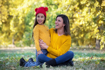 Mother and daughter have fun outside. Share love.