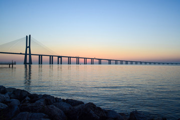 Fototapeta na wymiar Peaceful landscape of dawn over Vasco da Gama Bridge, Lisbon, Portugal