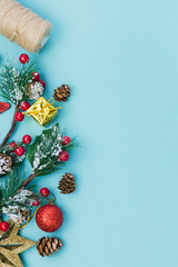 Christmas background with Christmas tree, cones, toys and more on blue background. Christmas greeting card. The theme of the winter holiday happy new year selective focus