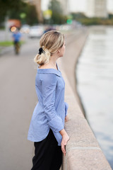 Moscow, Russia - August 09, 2019: A girl walks along the embankment of Moscow