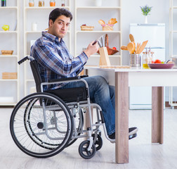 Disabled young man husband working in kitchen