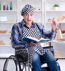 Young man cook with book of food recipes