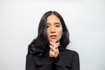 Woman with black curly hair Wearing a black turtleneck sweater Poses shooting on a white background