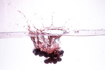 close-up of cherry in pure water with bubbles