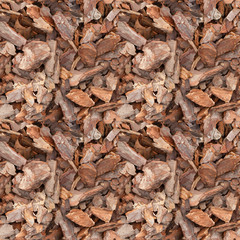 Seamless texture of pieces of pine bark. Background from pine chips close-up.