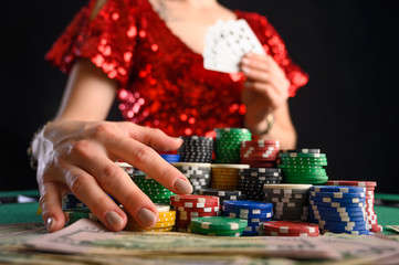 The girl won the cards in the casino and takes everything. Black Jack. poker. texas poker. gaming business