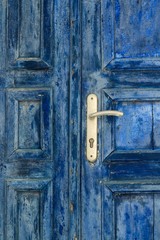 Full frame shot of weathered blue door 