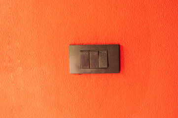 Switch on the orange wall.
