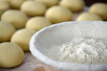 Fototapeta na wymiar Sweet bread dough with wheat flour basket detail