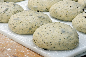 Fototapeta na wymiar Dough in fermentation to make olive bread