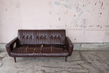 An abandoned sofa in the city