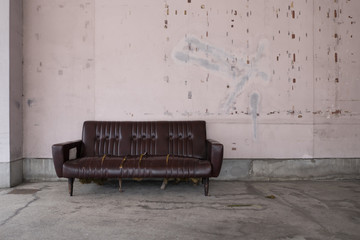 An abandoned sofa in the city