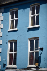 facade of building with windows and shutters