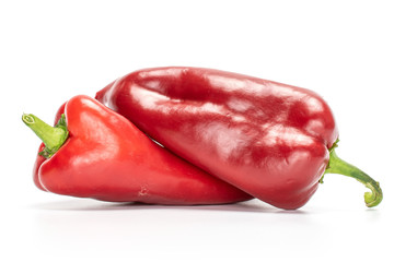 Group of two whole sweet red bell pepper isolated on white background