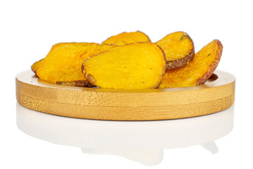 Lot of whole dry vegetable chip of gourd on bamboo coaster isolated on white background