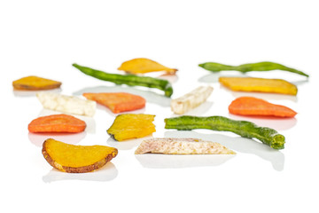 Lot of whole dry vegetable chip isolated on white background