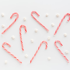 Christmas composition. lollipop canes and marshmallows on white. new year concept. Square Greeting card, winter holidays, xmas celebration 2020. Flat lay, top view, copy space, mockup, template