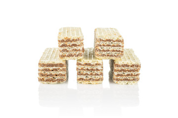 Group of five whole crispy beige hazelnut wafer cookie isolated on white background