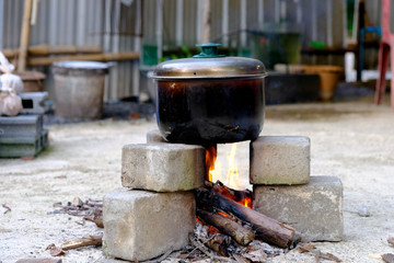 Cooking rice with traditional firewood