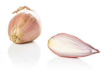 Group of one whole one half of fresh brown shallot isolated on white background