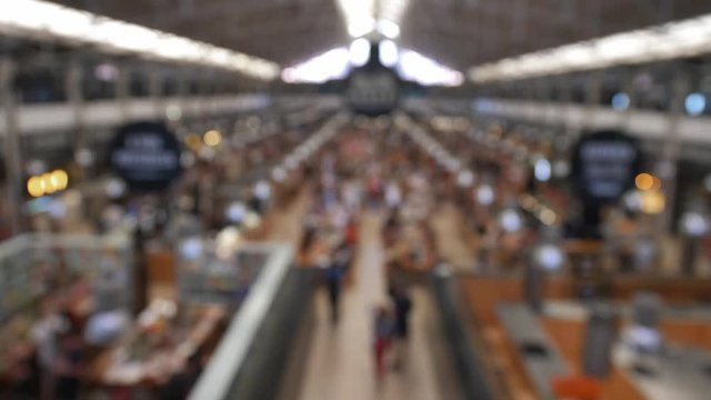 Anonymous Crowd in Food Hall Market Eating at Restaurant Tables