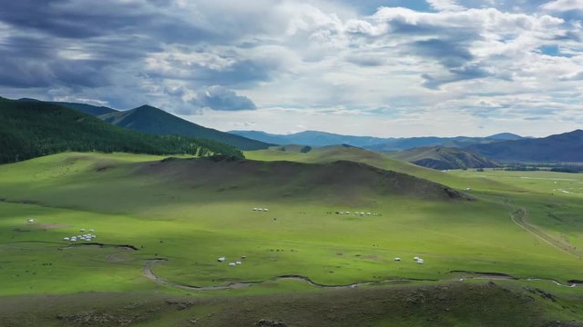 Aerial view of yurts in steppe and mountains landscape in Orkhon valley, Mongolia, 4k